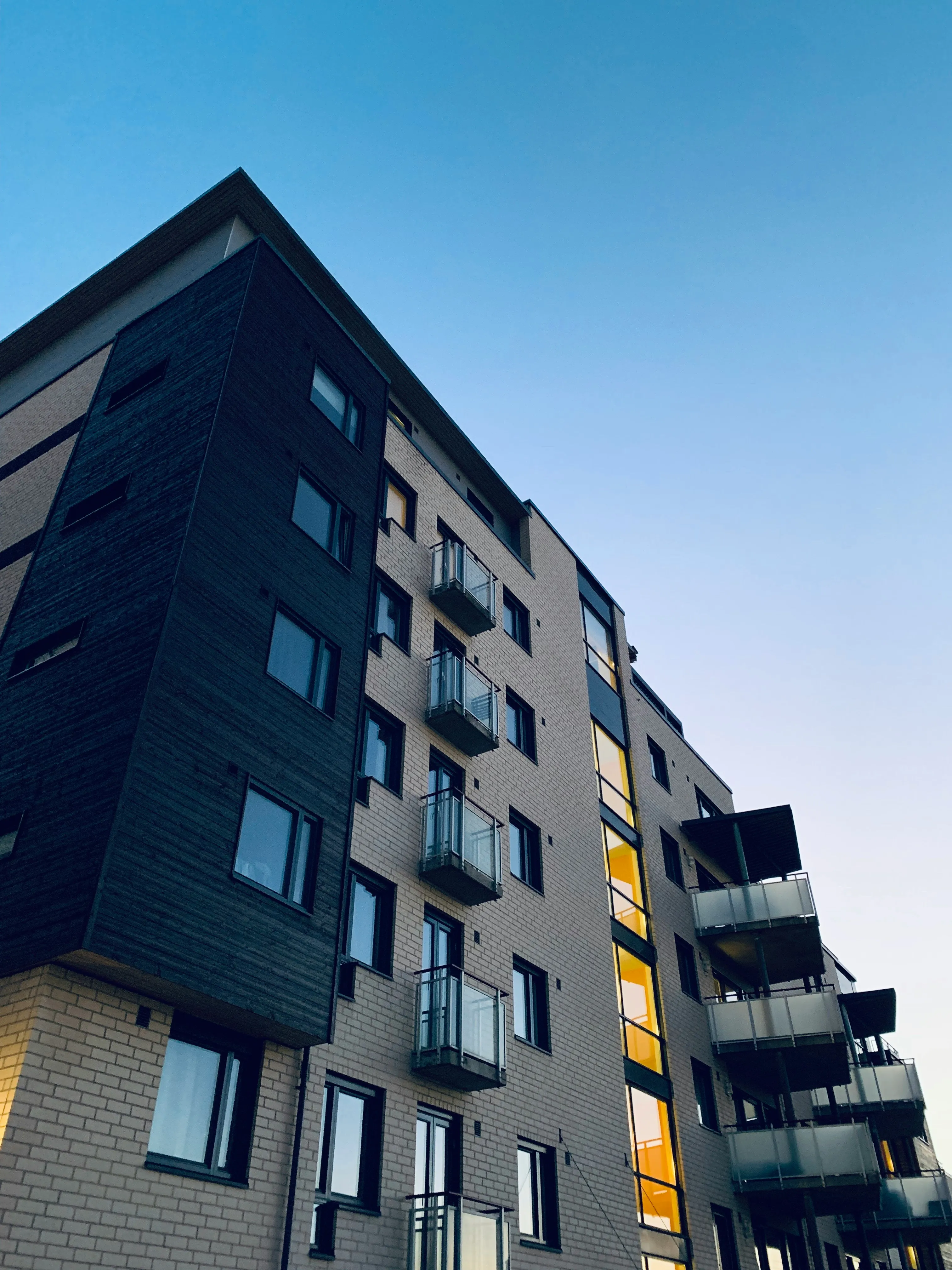 Modern apartment building against a blue sky