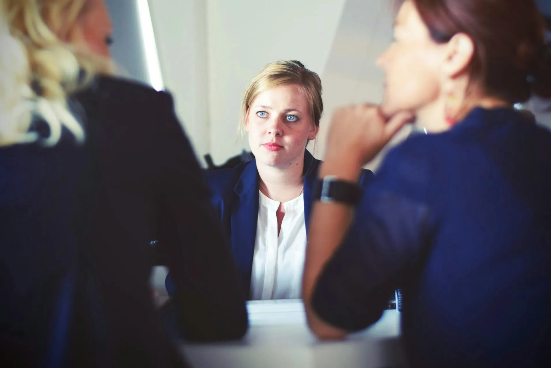 An attorney consulting with clients across a table